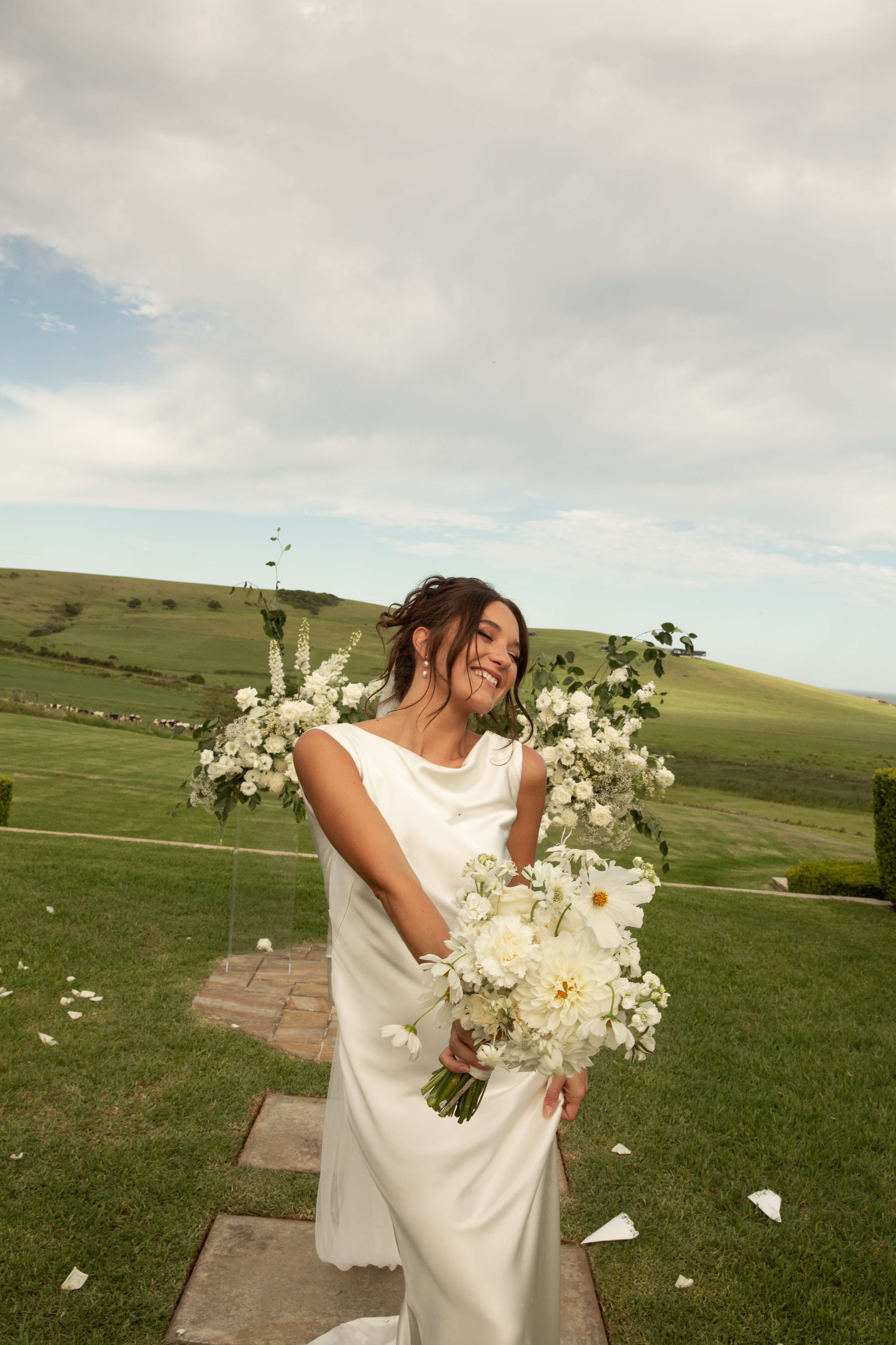 Bride holding her bouquet on her wedding day in an editorial bridal portrait